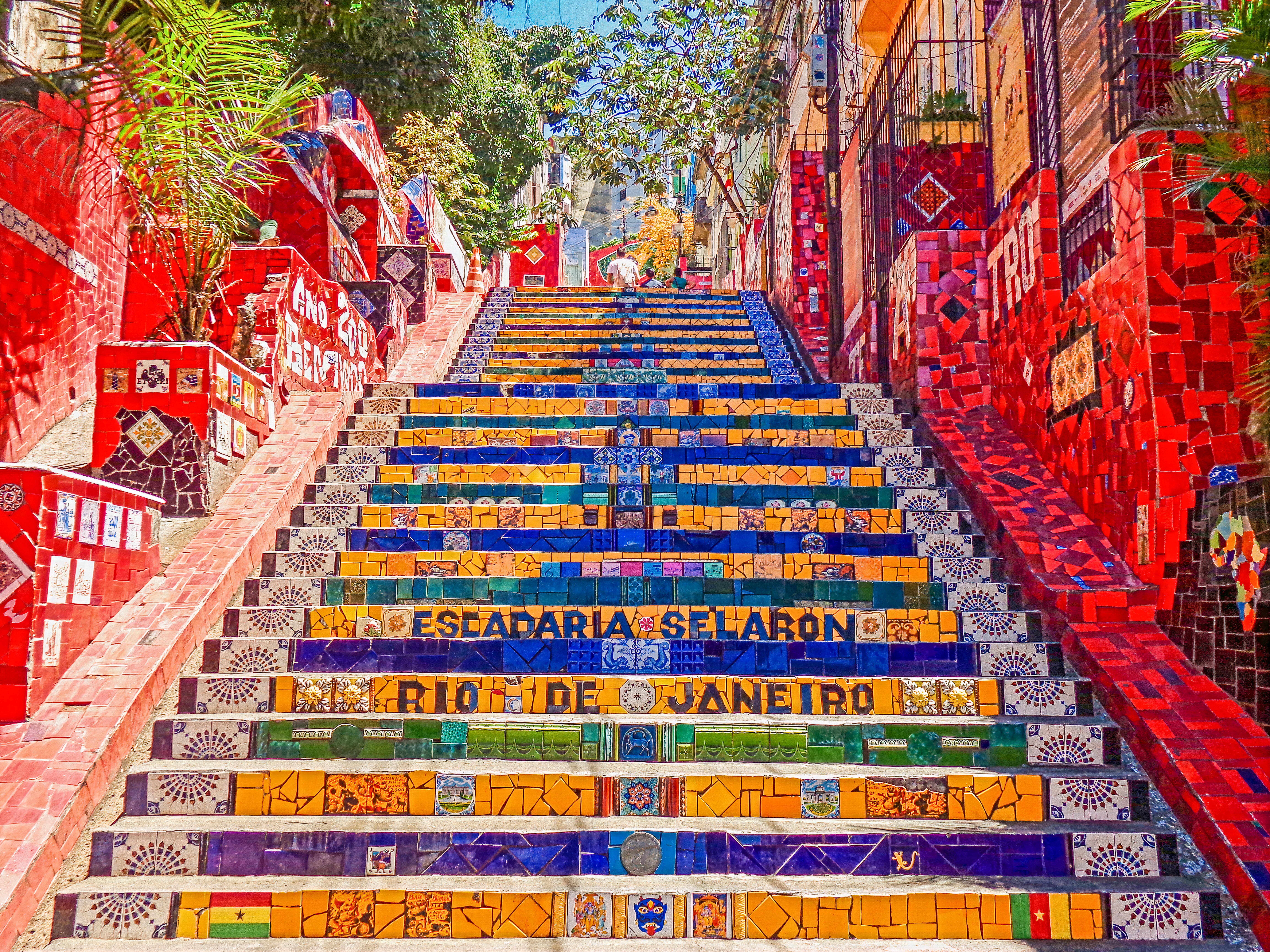 Tiled stairs climb away from the camera. The stairs feature tiles that spell out Escadaria Selaron, Rio de Janeiro.