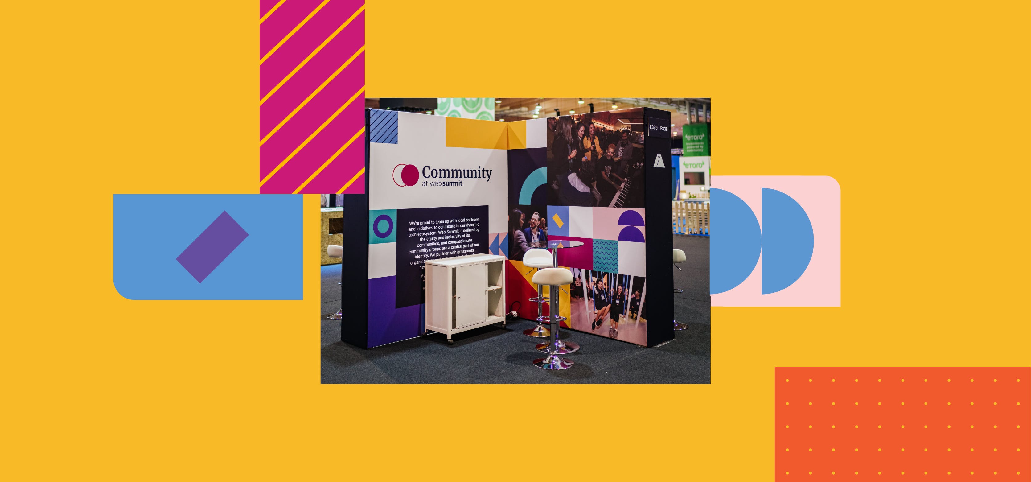 An image of a community exhibition stand at a pavilion during Web Summit. A storage unit, two chairs and a table with a glass top are in the image.
