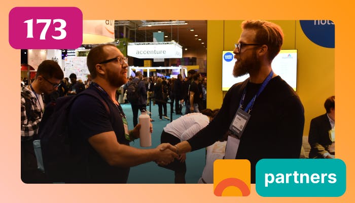 Two people greeting each other at a Web Summit event.