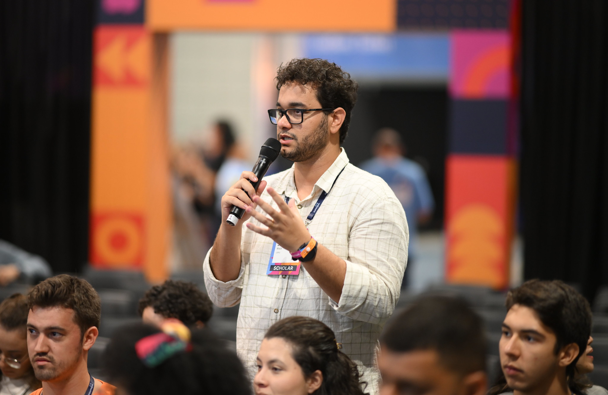 An attendee asks a question at the Scholarship Session hosted by Brian Collins, Co-founder & Chief Creative Officer, COLLINS, at the Startup Masterclass
